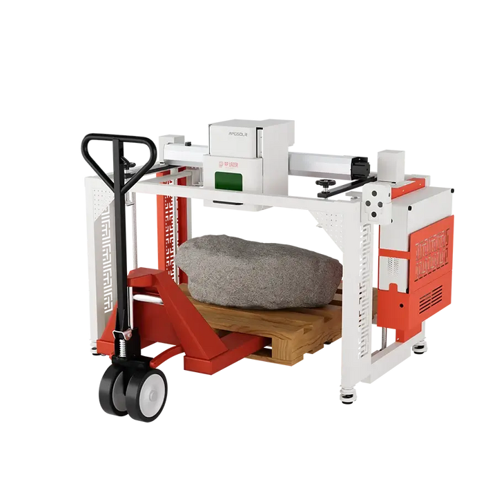 A large gray rock sitting on a wooden pallet under a Low-Rider Fiber Laser Marking Machine
